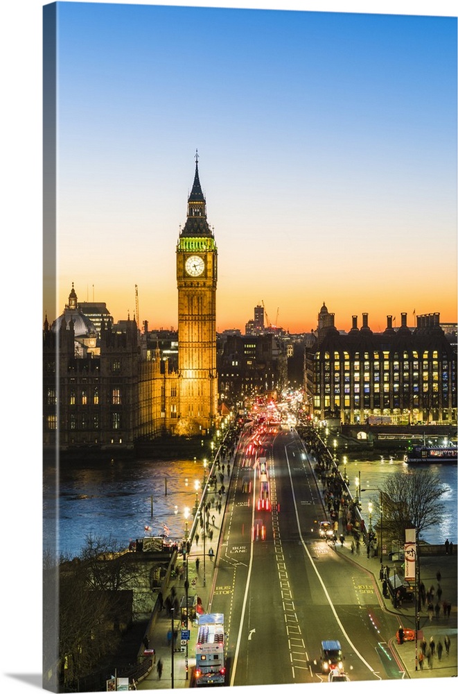 Big Ben, and busy traffic on Westminster Bridge at dusk, London, England