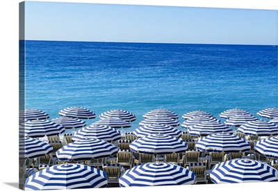 Blue and white beach parasols, Nice, Alpes Maritimes, Cote d'Azur, Provence, France
