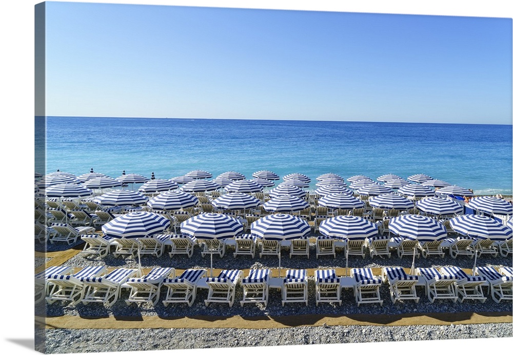 Blue and white beach parasols, Nice, Alpes-Maritimes, Cote d'Azur, Provence, French Riviera, France, Mediterranean, Europe
