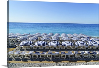 Blue and white beach parasols, Nice, French Riviera, France