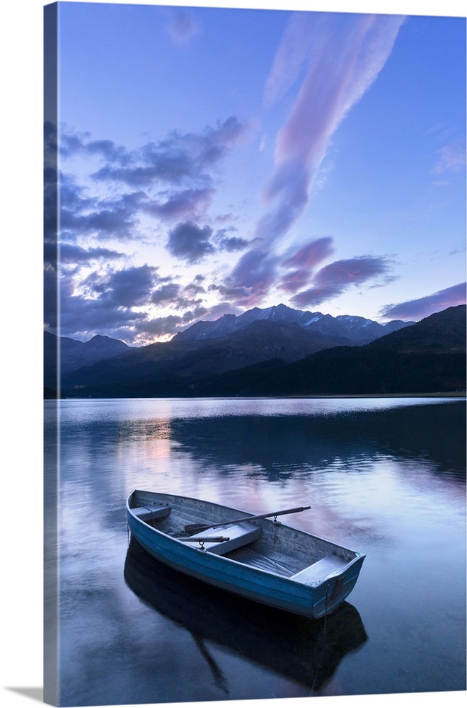Single moored boat in the Lake of Sils at sunrise, Maloja pass, Engadine valley, Graubunden, Switzerland, Europe