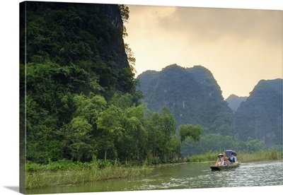 Boats in the karst landscapes of Tam Coc and Trang An in the Red River area, Vietnam