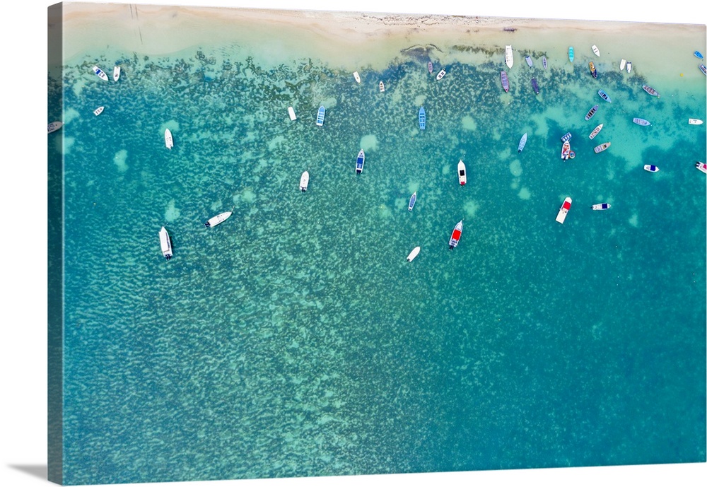 Aerial by drone of boats in the turquoise water of lagoon front of Mont Choisy beach, north-west coast, Mauritius, Indian ...