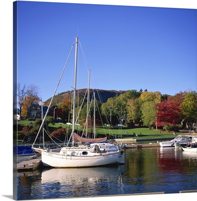 Boats on waterfront at Camden harbour with Mount Battie, Maine, USA