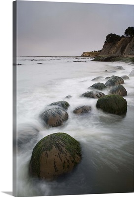 Boulders, known as Bowling Balls, in the surf, Bowling Ball Beach, California