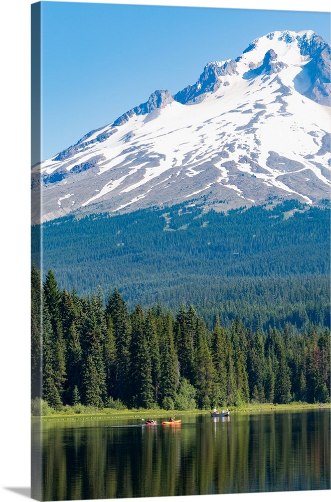 Canoes and rowboat on Trillium Lake with Mount Hood, Cascade Range, Oregon