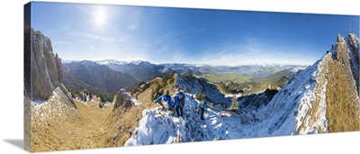 Climbers on steep crest covered with snow in the Ammergau Alps, Bavaria, Germany