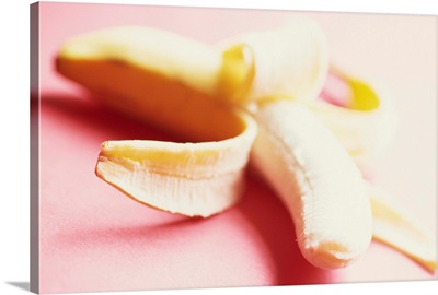 Close-up of a partly peeled banana