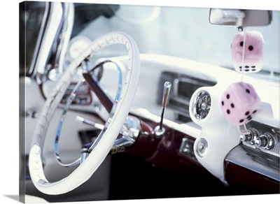 Close-up of steering wheel and interior of a pink Cadillac car