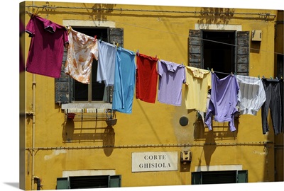 Clothes hanging on a washing line between houses, Venice, Veneto, Italy