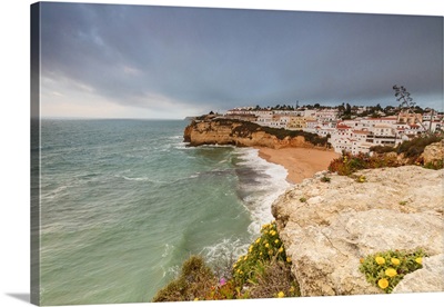 Clouds on Carvoeiro village surrounded by sandy beach, Lagoa Municipality, Portugal