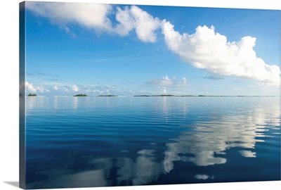 Clouds reflecting in the calm waters of Tikehau, Tuamotus, French Polynesia