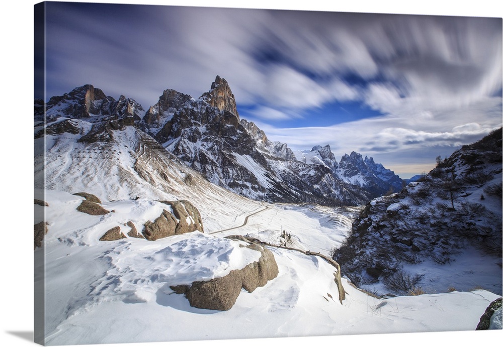 Cloudy winter sky on the snowy peaks of the Pale di San Martino, Rolle Pass, Panaveggio, Dolomites, Trentino-Alto Adige, I...