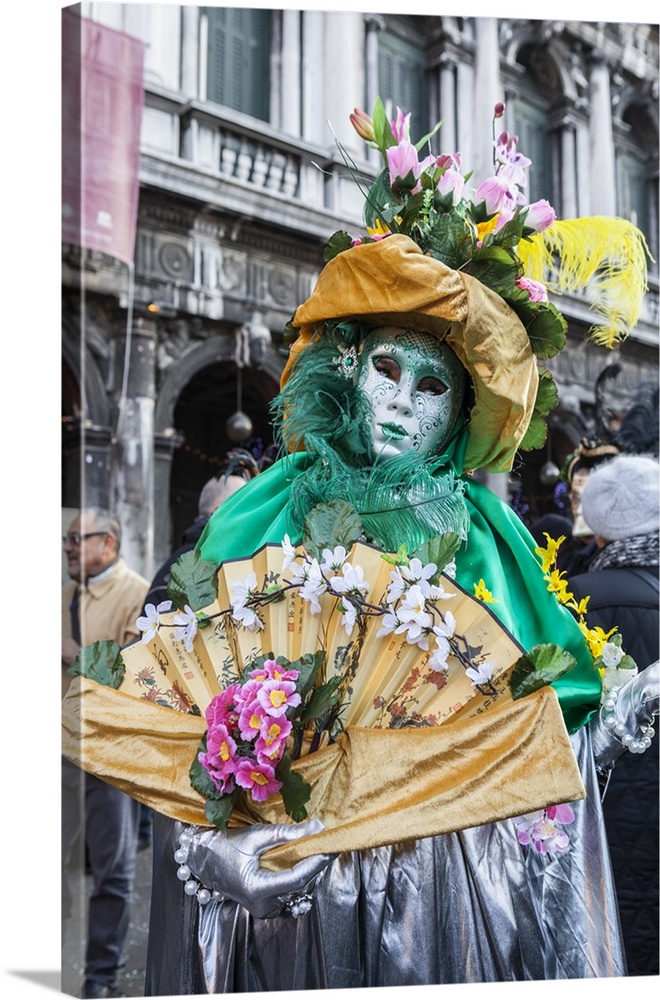 Colourful mask and costume of the Carnival of Venice, famous festival worldwide, Venice, Veneto, Italy