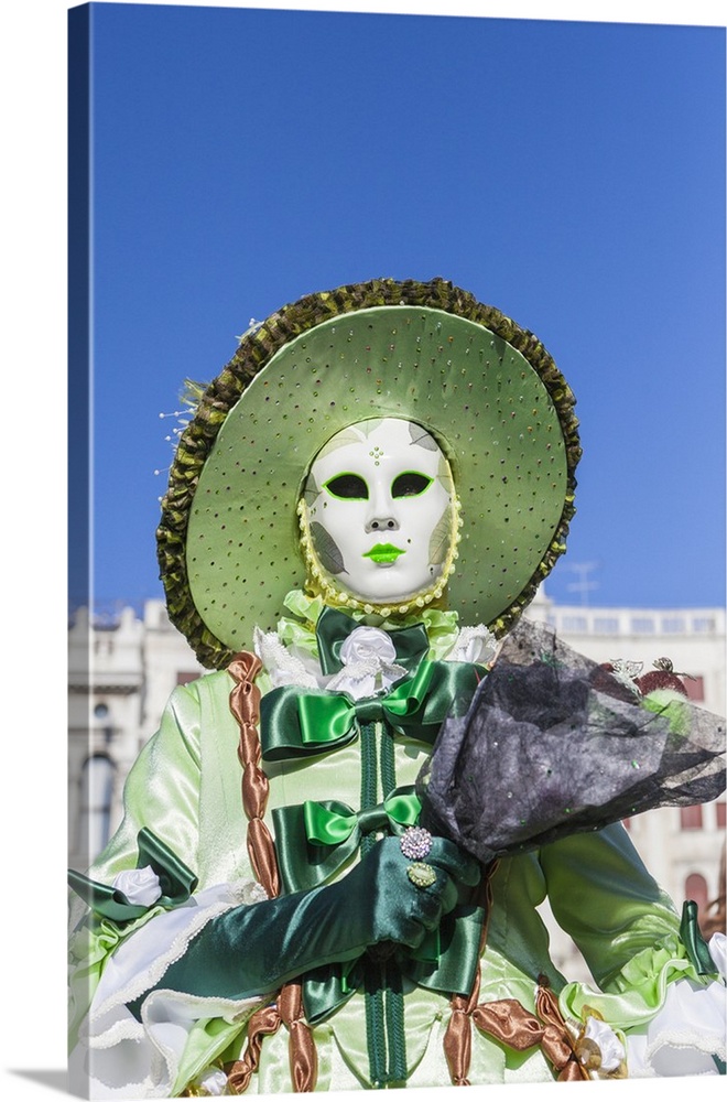 Colourful mask and costume of the Carnival of Venice, famous festival worldwide, Venice, Veneto, Italy