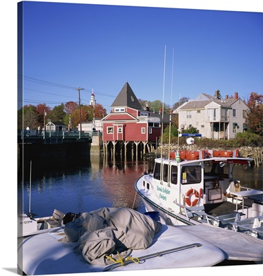 Cruise boat in harbour with wooden buildings, Maine, New England, USA