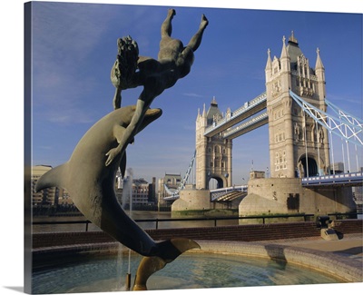 Dolphin sculpture and Tower Bridge, London, England, UK