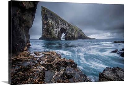 Dramatic Sea Arch Of Drangarnir And Waves Crashing On The Faroe Islands Coast, Denmark