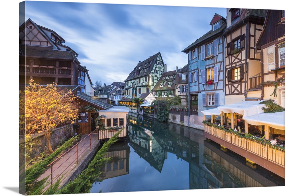 Dusk lights on houses reflected in River Lauch at Christmas, Petite Venise, Colmar, Haut-Rhin department, Alsace, France, ...