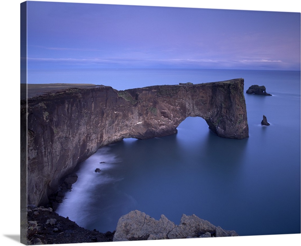 Dyrholaey natural arch, southernmost point in Iceland, at dusk, near Vik, Iceland