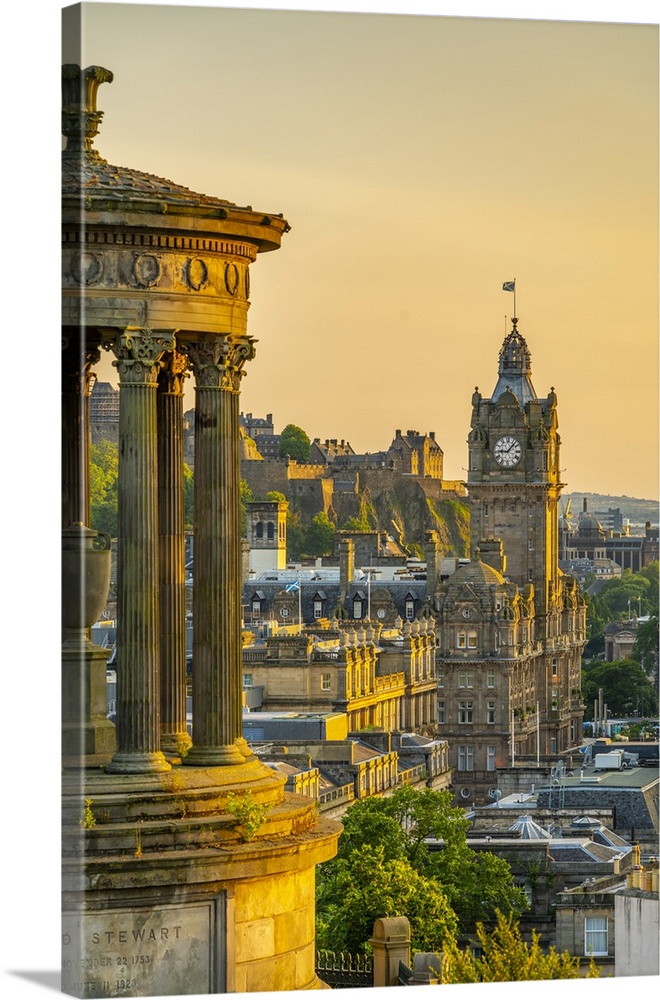 View of Edinburgh Castle, Balmoral Hotel and Dugald Stewart monument from Calton Hill at golden hour, UNESCO World Heritag...