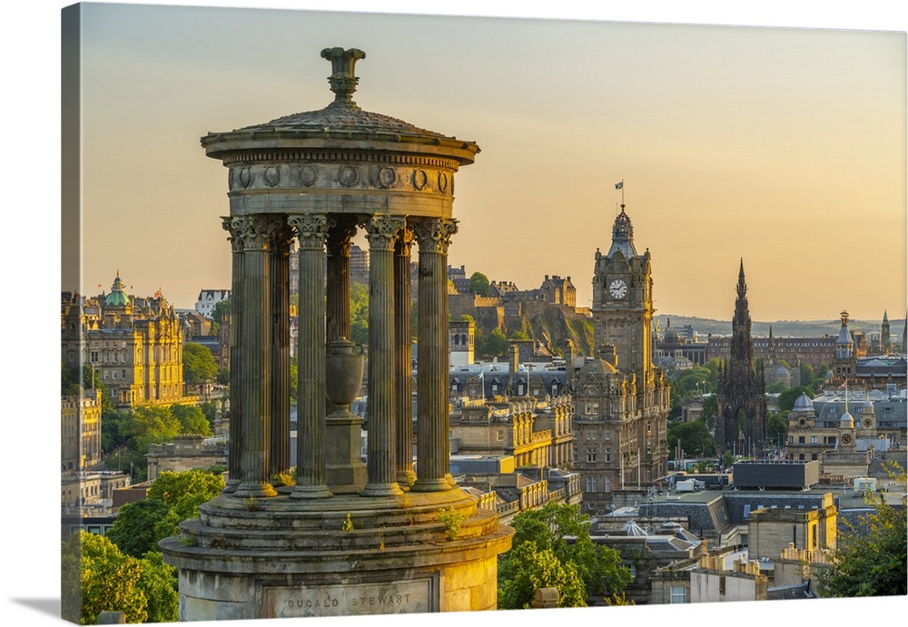 View of Edinburgh Castle, Balmoral Hotel and Dugald Stewart monument from Calton Hill at golden hour, UNESCO World Heritag...