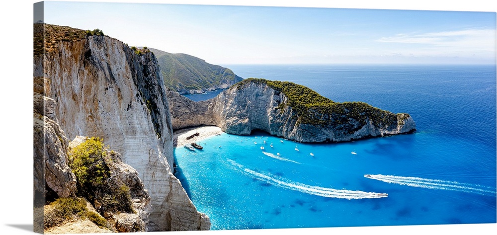 Ferry boats in the turquoise lagoon surrounding the iconic Shipwreck Beach (Navagio Beach), aerial view, Zakynthos, Greek ...