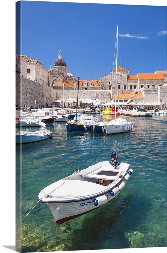 Fishing boat and clear water in the Old Port, Dubrovnik Old Town, Dubrovnik, Dalmatian Coast, Croatia
