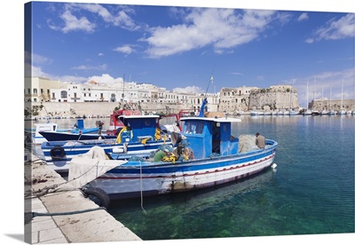 Fishing boats at the port, old town with castle, Gallipoli, Puglia, Italy