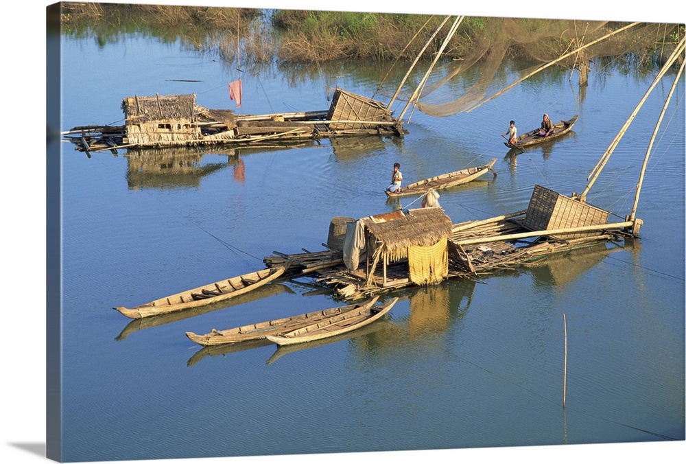 Fishing rafts and fishermen on canoes in Cambodia, Indochina, Southeast Asia