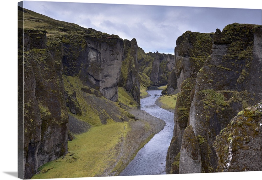 Fjadrargljufur Canyon, 100m deep and 2 km long, carved out of palagonite and lava layers by glacial river two million year...