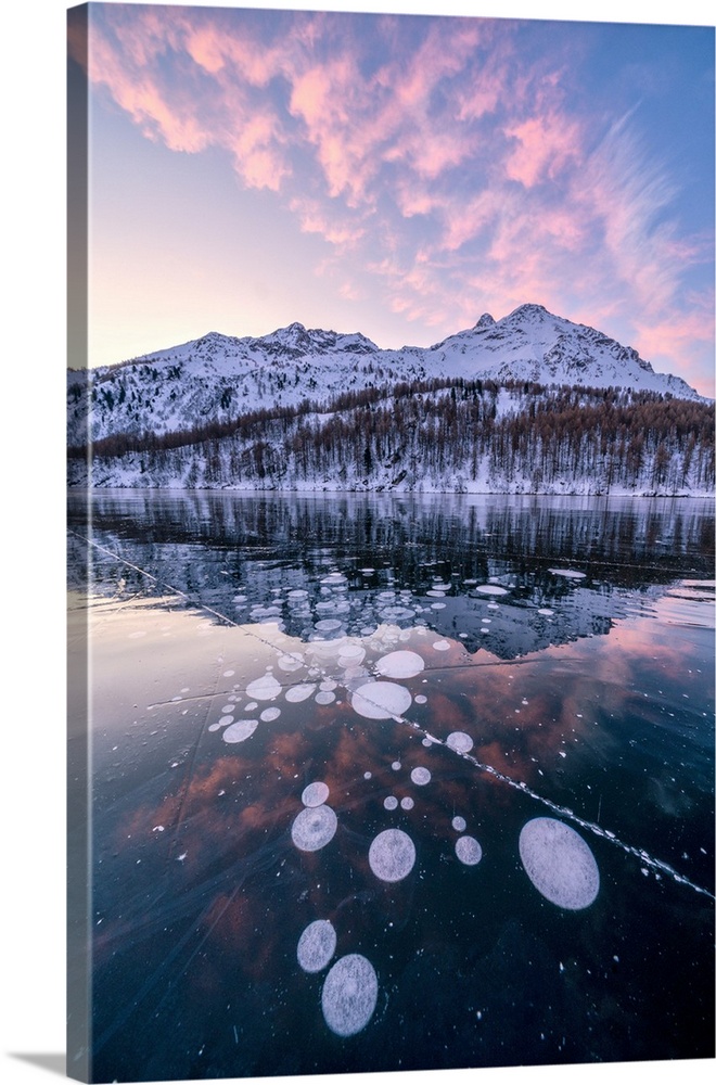 Frozen Lake Sils at sunrise with Piz Da La Margna in background, Engadine, canton of Graubunden, Switzerland, Europe