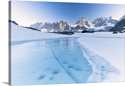 Frozen Water Of Forbici Lake During The Spring Thaw, Valtellina, Lombardy, Italy