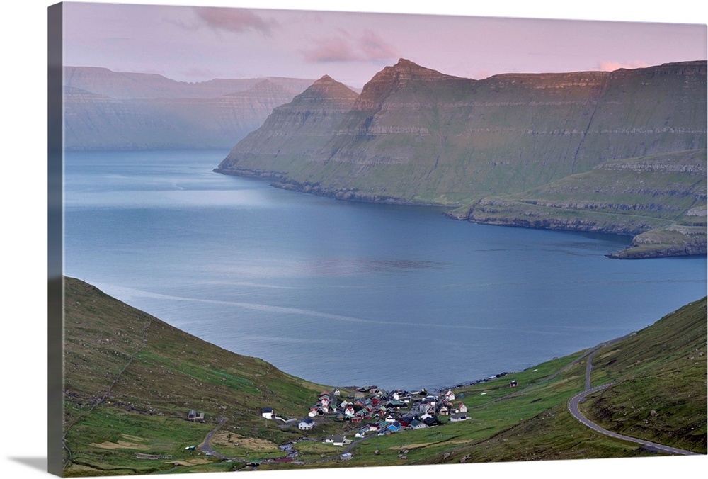 Funningur in Funningsfjordur, with view on Eysturoy and Kalsoy  steep hills, at sunset. Eysturoy, Faroe Islands , Denmark