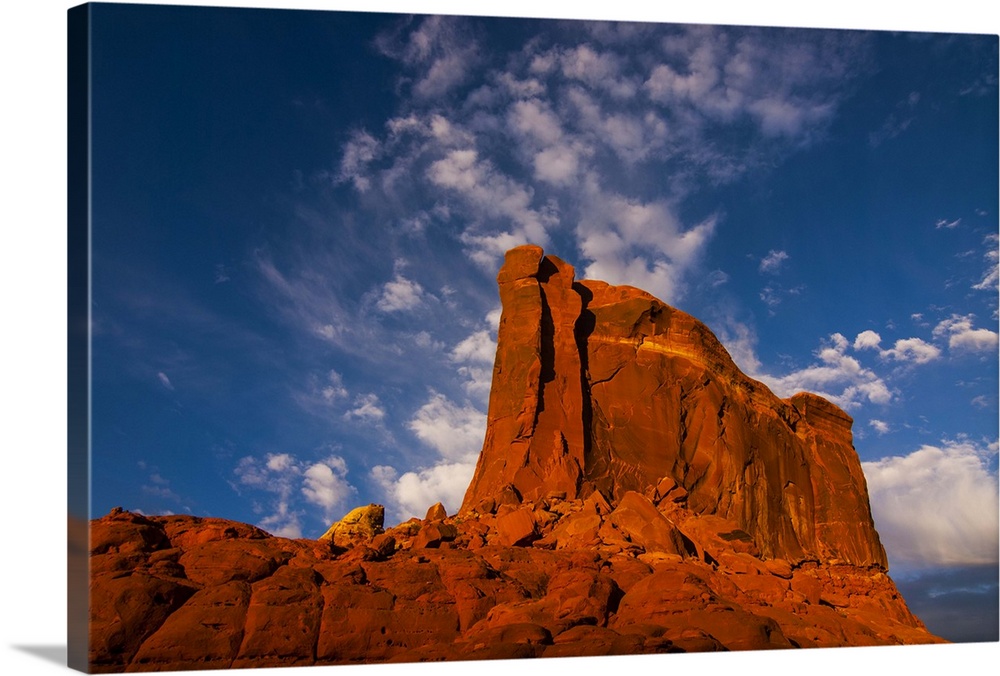 Giant rock in the late afternoon light on top of a plateau near Moab, Utah
