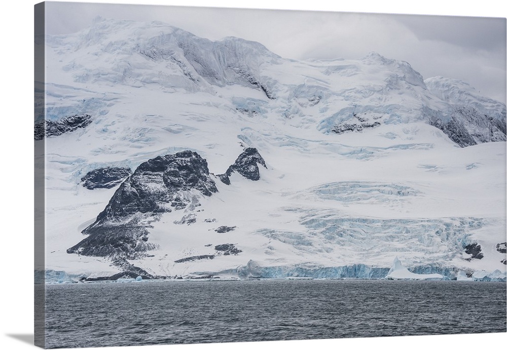 Glacier hanging on the rocks of Coronation Island, South Orkney Islands, Antarctica, Polar Regions