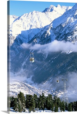 Gondolas rising above village of Solden in Tirol Alps, Tirol, Austria, Europe