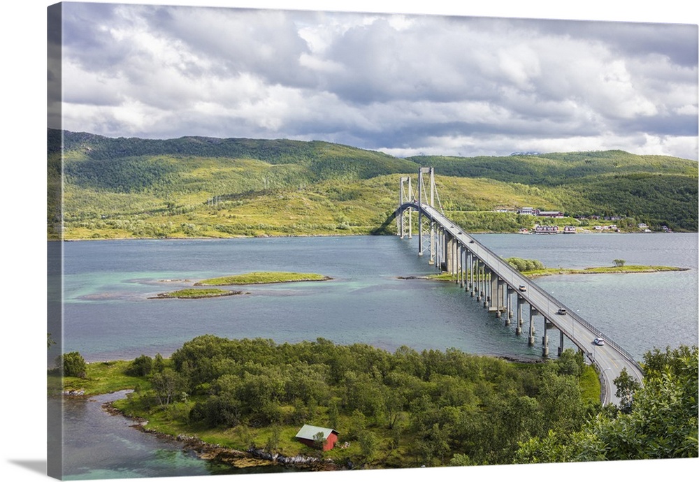 Green hills and turquoise sea frame the suspension road bridge in Tjeldsundbrua, Troms county, Nordland, Norway, Scandinavia