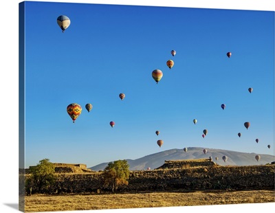 Hot Air Balloons Flying Over The Teotihuacan Archaeological Site At Sunrise, Mexico