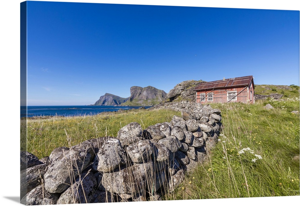 House of fishermen called rorbu surrounded by sea, Sorland, Vaeroy Island, Nordland county, Lofoten archipelago, Norway, S...