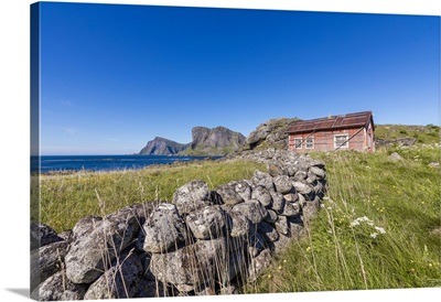 House of fishermen called rorbu surrounded by sea, Norway