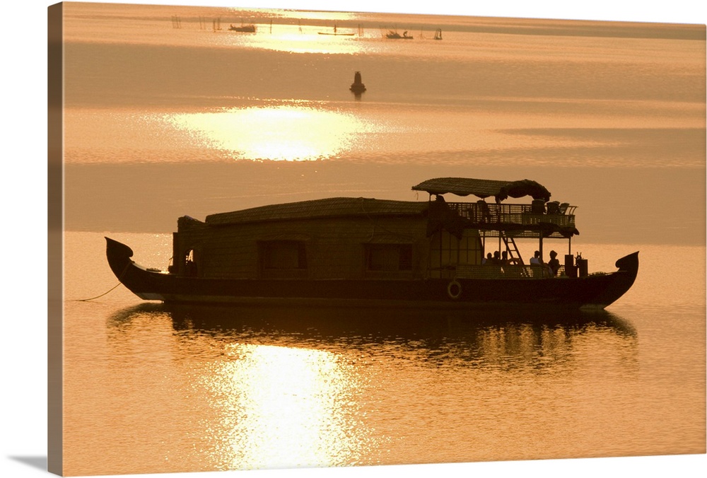 Houseboat at dusk in Ashtamudi Lake, Kollam, Kerala, India, Asia