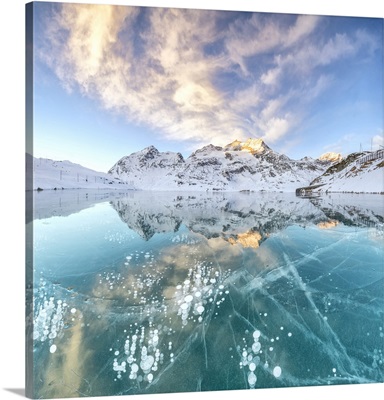 Ice bubbles and frozen surface of Lago Bianco, Bernina Pass, Engadine, Switzerland
