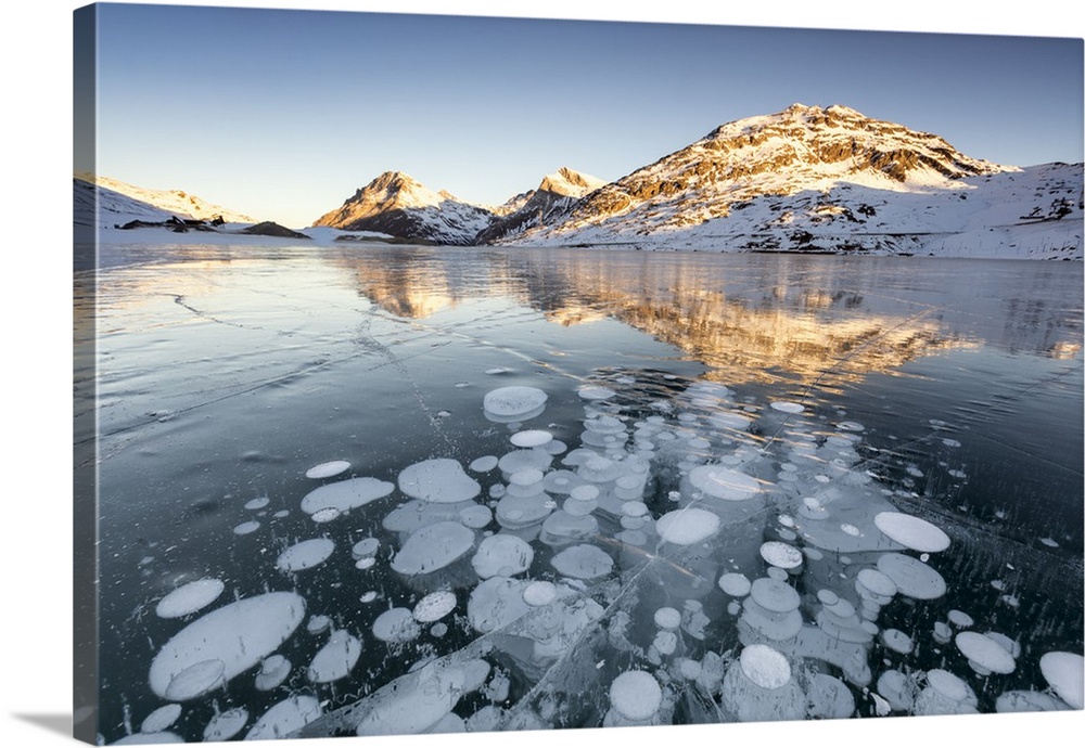 Ice bubbles at sunrise, Bianco Lake, Bernina Pass, Engadine, Switzerland