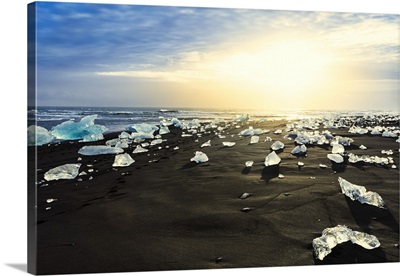 Icebergs on a black sand volcanic beach next to the Jokulsarlon glacial lake, Iceland