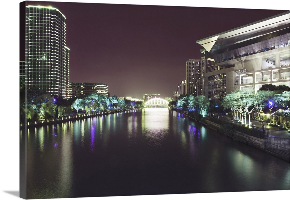 Illuminated architecture and reflections at night in Hangzhou City Center, Hangzhou, Zhejiang, China