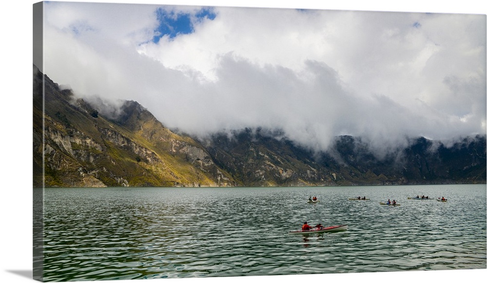 Kayaks at Quilotoa, a water-filled caldera and the most western volcano in the Ecuadorian Andes, Ecuador