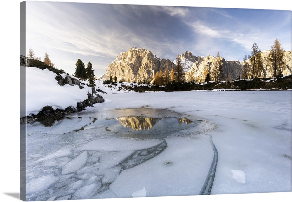 Lagazuoi mountain mirrored in the icy lake Limides at dawn, Ampezzo Dolomites, Belluno province, Veneto, Italy, Europe