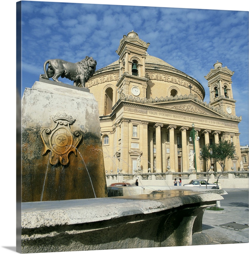 Lion on a fountain in front of the Rotunda church at Mosta, Malta, Europe