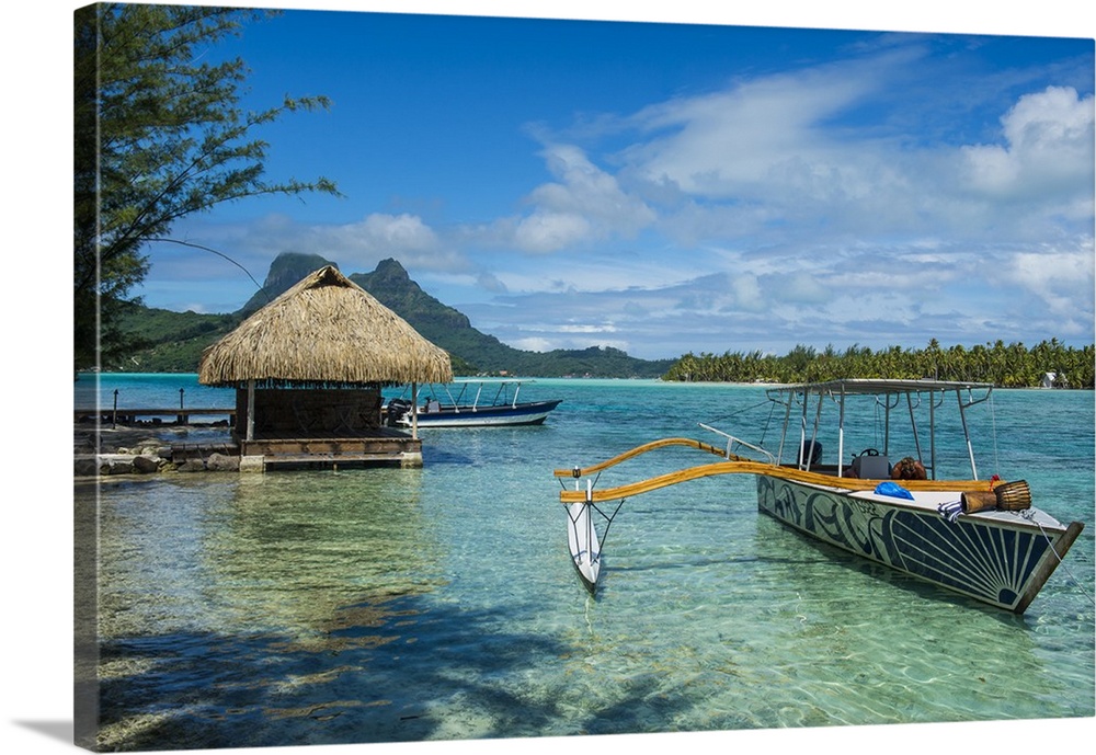 Little boat anchoring on a small Motu, Bora Bora, Society Islands, French Polynesia